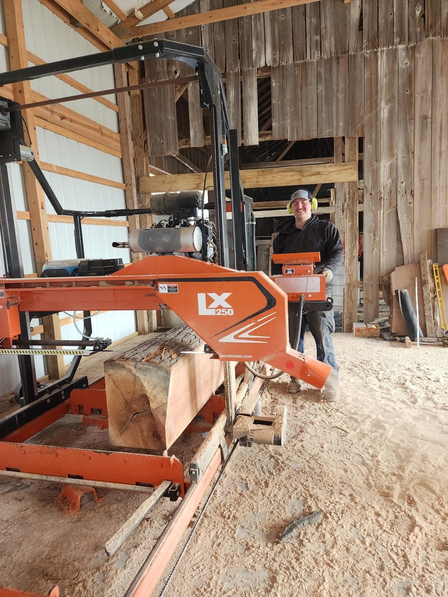 Brady Vail operating the Wood-Mizer LX250 bandsaw mill in Butler, Indiana